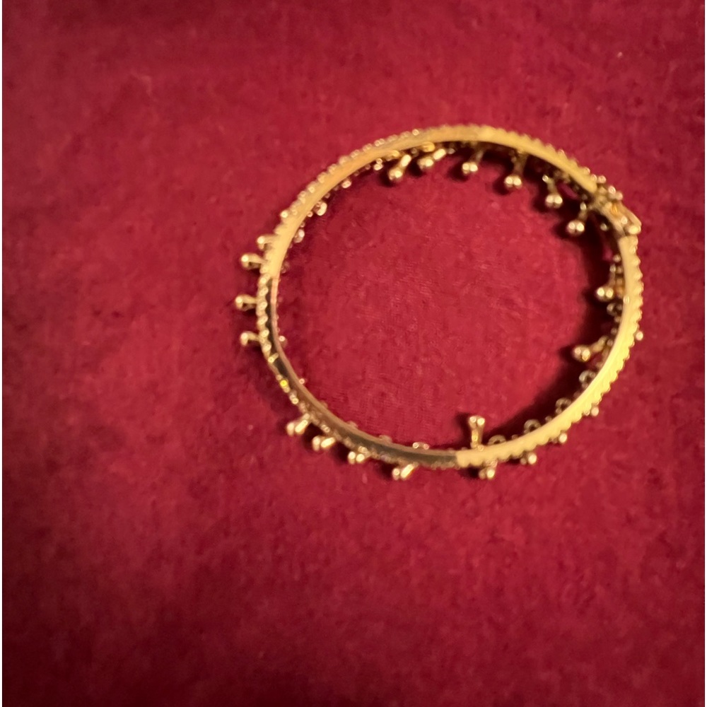 What a unique bracelet, Gold tone with hanging Gold, danglers, and crystals